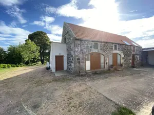 Stone walled cottage in the sun